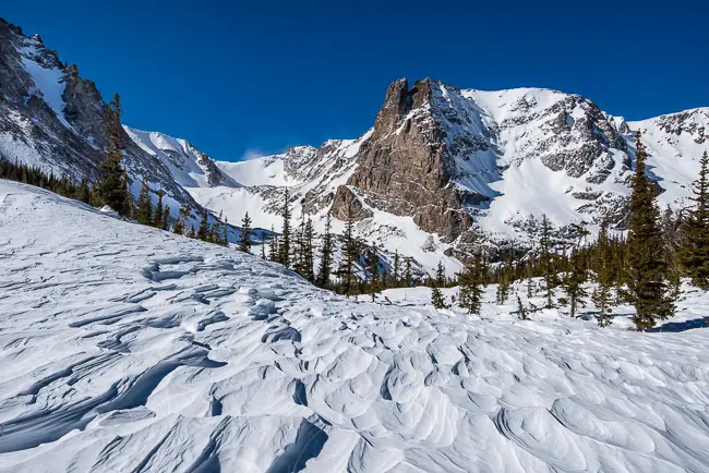 Notchtop Mountain and rippled snow on an Estes Park Snowshoeing Tour